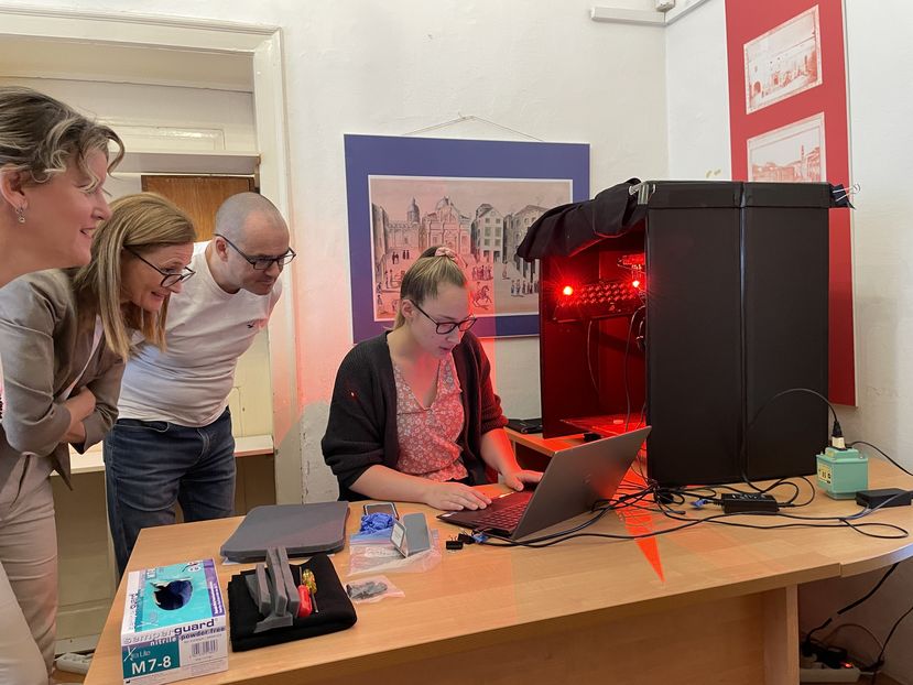 Photo: RIT students demonstrating the MISHA system at the Dubrovnik Archive